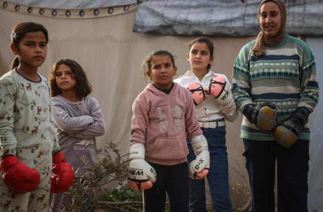 Palestinian girls attend a boxing training session between displacement tents in Khan Yunis, in the southern Gaza Strip, on February 9, 2026. A US-brokered ceasefire, which sought to halt the fighting between Israel and Hamas sparked by the group's October 2023 attack, took effect last October, reducing the level of bombing and fighting. 
After a long hiatus from training, the women's boxing team - which consists of 45 boxers between the ages of 8 and 19 - has resumed its sessions under the guidance of their coach Osama Ayoub. (Photo by BASHAR TALEB / AFP)