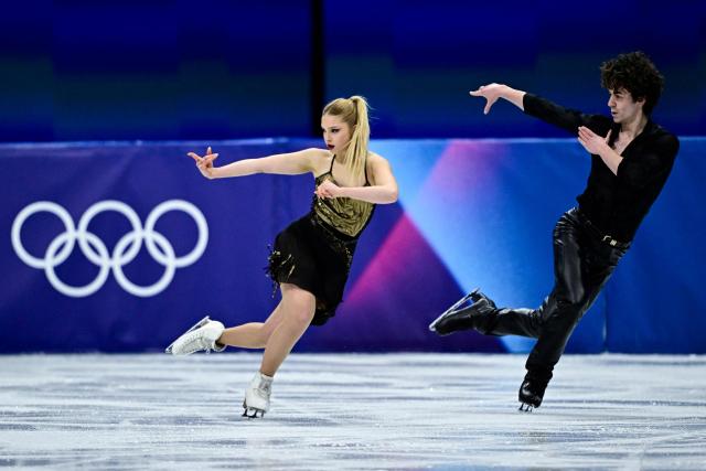 Spain's Sofia Val and Spain's Asaf Kazimov compete in the figure skating team event ice dance-rhythm dance during the Milano Cortina 2026 Winter Olympic Games at Milano Ice Skating Arena in Milan on February 9, 2026. (Photo by JULIEN DE ROSA / AFP)