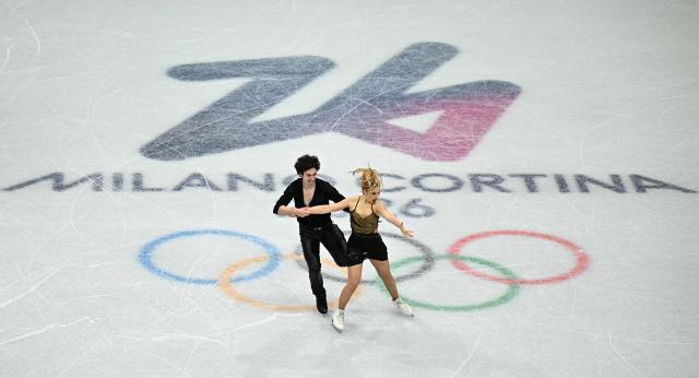 Spain's Sofia Val and Spain's Asaf Kazimov compete in the figure skating team event ice dance-rhythm dance during the Milano Cortina 2026 Winter Olympic Games at Milano Ice Skating Arena in Milan on February 9, 2026. (Photo by Gabriel BOUYS / AFP)