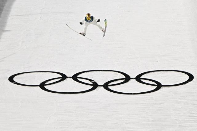 Poland's Kacper Tomasiak jumps during the men's ski jumping normal hill individual 1st round of the Milano Cortina 2026 Winter Olympic Games at Predazzo Ski Jumping Stadium in Predazzo (Val di Fiemme), on February 9, 2026. (Photo by Javier SORIANO / AFP)