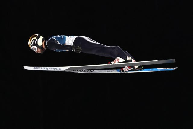 Bulgaria's Vladimir Zografski jumps during the men's ski jumping normal hill individual 1st round of the Milano Cortina 2026 Winter Olympic Games at Predazzo Ski Jumping Stadium in Predazzo (Val di Fiemme), on February 9, 2026. (Photo by Anne-Christine POUJOULAT / AFP)