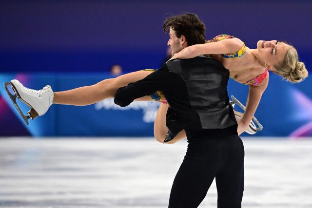 Britain's Phebe Bekker and Britain's James Hernandez compete in the figure skating team event ice dance-rhythm dance during the Milano Cortina 2026 Winter Olympic Games at Milano Ice Skating Arena in Milan on February 9, 2026. (Photo by Piero CRUCIATTI / AFP)