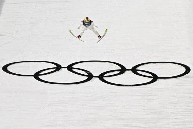 Austria's Jan Hoerl jumps during the men's ski jumping normal hill individual 1st round of the Milano Cortina 2026 Winter Olympic Games at Predazzo Ski Jumping Stadium in Predazzo (Val di Fiemme), on February 9, 2026. (Photo by Javier SORIANO / AFP)
