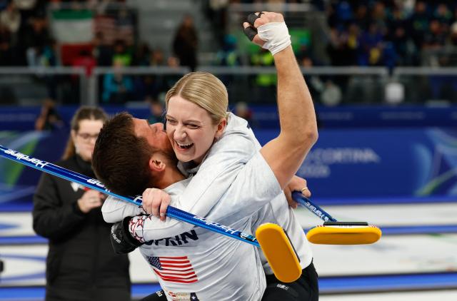 US' Cory Thiesse and US' Korey Dropkin celebrates at the end of the curling mixed doubles round robin semi-final between USA and Italy during the Milano Cortina 2026 Winter Olympic Games at the Cortina Curling Olympic Stadium in Cortina d’Ampezzo on February 9, 2026. (Photo by Odd ANDERSEN / AFP)