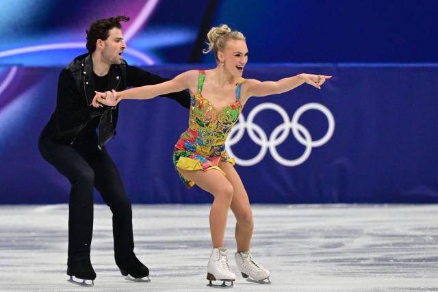 Britain's Phebe Bekker and Britain's James Hernandez compete in the figure skating team event ice dance-rhythm dance during the Milano Cortina 2026 Winter Olympic Games at Milano Ice Skating Arena in Milan on February 9, 2026. (Photo by Piero CRUCIATTI / AFP)