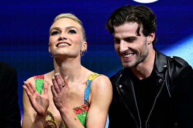 Britain's Phebe Bekker and Britain's James Hernandez react in the kiss and cry area after competing in the figure skating team event ice dance-rhythm dance during the Milano Cortina 2026 Winter Olympic Games at Milano Ice Skating Arena in Milan on February 9, 2026. (Photo by JULIEN DE ROSA / AFP)