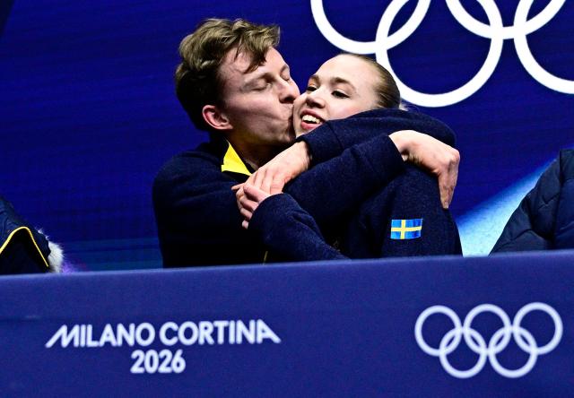 Sweden's Milla Reitan and Sweden's Nikolaj Majorov react in the kiss and cry area after competing in the figure skating team event ice dance-rhythm dance during the Milano Cortina 2026 Winter Olympic Games at Milano Ice Skating Arena in Milan on February 9, 2026. (Photo by JULIEN DE ROSA / AFP)