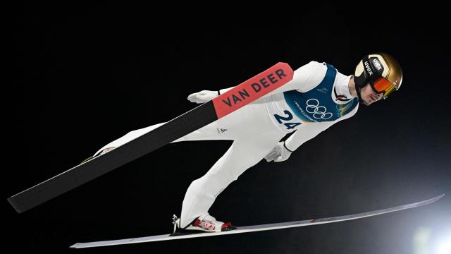 Switzerland's Sandro Hauswirth jumps during the men's ski jumping normal hill individual final round of the Milano Cortina 2026 Winter Olympic Games at Predazzo Ski Jumping Stadium in Predazzo (Val di Fiemme), on February 9, 2026. (Photo by Tobias SCHWARZ / AFP)