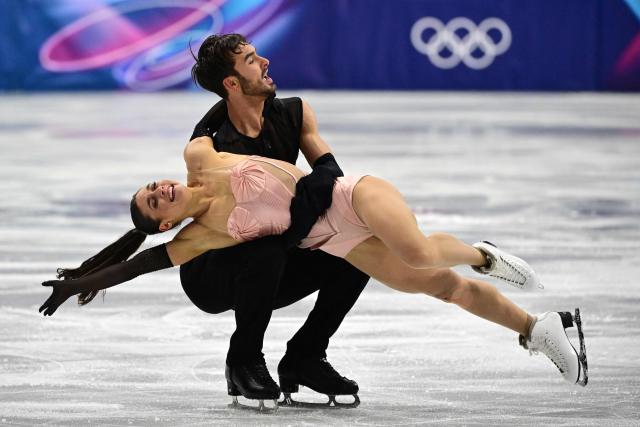 France's Laurence Fournier Beaudry and France's Guillaume Cizeron compete in the figure skating team event ice dance-rhythm dance during the Milano Cortina 2026 Winter Olympic Games at Milano Ice Skating Arena in Milan on February 9, 2026. (Photo by Piero CRUCIATTI / AFP)