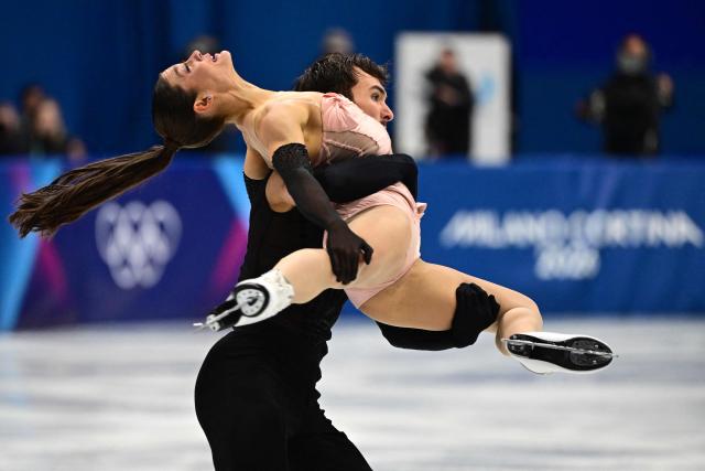 France's Laurence Fournier Beaudry and France's Guillaume Cizeron compete in the figure skating team event ice dance-rhythm dance during the Milano Cortina 2026 Winter Olympic Games at Milano Ice Skating Arena in Milan on February 9, 2026. (Photo by Piero CRUCIATTI / AFP)