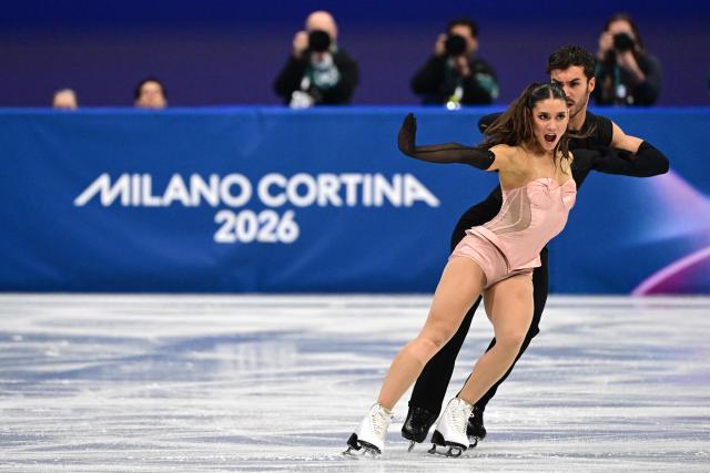 France's Laurence Fournier Beaudry and France's Guillaume Cizeron compete in the figure skating team event ice dance-rhythm dance during the Milano Cortina 2026 Winter Olympic Games at Milano Ice Skating Arena in Milan on February 9, 2026. (Photo by Piero CRUCIATTI / AFP)
