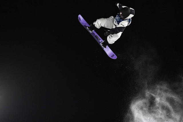 Japan's Reira Iwabuchi competes in the snowboard women's big air final run 3 during the Milano Cortina 2026 Winter Olympic Games at Livigno Snow Park, in Livigno (Valtellina), on February 9, 2026. (Photo by Jeff PACHOUD / AFP)