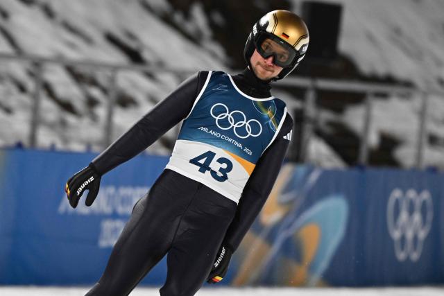 Germany's Felix Hoffmann reacts in the finish area after jumping during the men's ski jumping normal hill individual final round of the Milano Cortina 2026 Winter Olympic Games at Predazzo Ski Jumping Stadium in Predazzo (Val di Fiemme), on February 9, 2026. (Photo by Javier SORIANO / AFP)