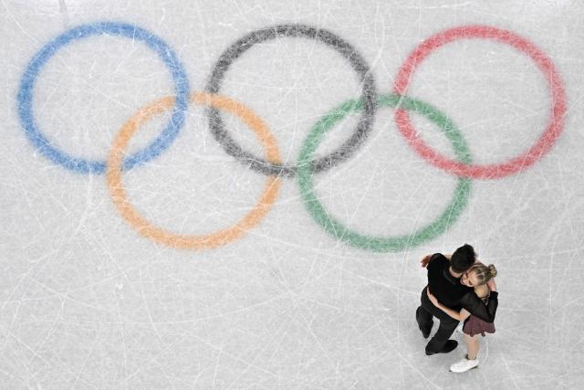 Finland's Juulia Turkkila and Finland's Matthias Versluis react after competing in the figure skating team event ice dance-rhythm dance during the Milano Cortina 2026 Winter Olympic Games at Milano Ice Skating Arena in Milan on February 9, 2026. (Photo by Antonin THUILLIER / AFP)