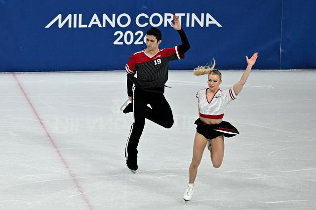 Canada's Marjorie Lajoie and Canada's Zachary Lagha compete in the figure skating team event ice dance-rhythm dance during the Milano Cortina 2026 Winter Olympic Games at Milano Ice Skating Arena in Milan on February 9, 2026. (Photo by Gabriel BOUYS / AFP)