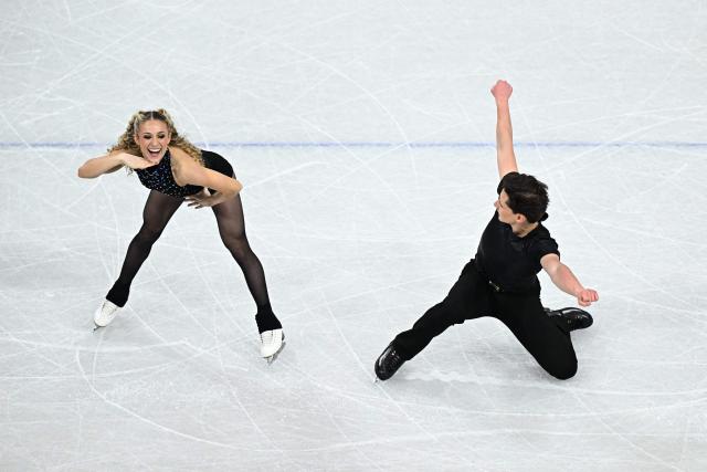USA's Emilea Zingas and USA's Vadym Kolesnik compete in the figure skating team event ice dance-rhythm dance during the Milano Cortina 2026 Winter Olympic Games at Milano Ice Skating Arena in Milan on February 9, 2026. (Photo by Gabriel BOUYS / AFP)
