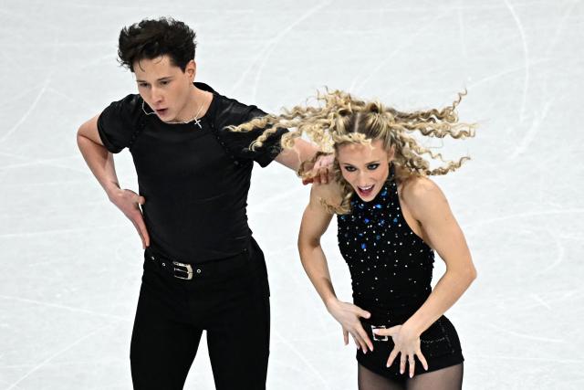 USA's Emilea Zingas and USA's Vadym Kolesnik compete in the figure skating team event ice dance-rhythm dance during the Milano Cortina 2026 Winter Olympic Games at Milano Ice Skating Arena in Milan on February 9, 2026. (Photo by Gabriel BOUYS / AFP)