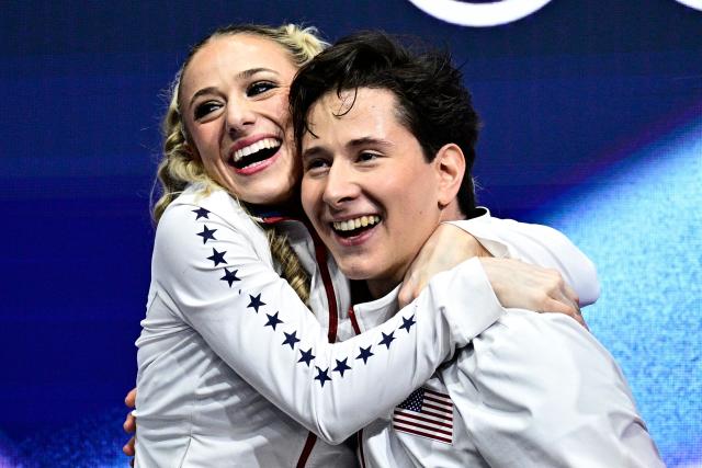 TOPSHOT - USA's Emilea Zingas and USA's Vadym Kolesnik react in the kiss and cry area after competing in the figure skating team event ice dance-rhythm dance during the Milano Cortina 2026 Winter Olympic Games at Milano Ice Skating Arena in Milan on February 9, 2026. (Photo by JULIEN DE ROSA / AFP)