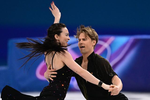 Lithuania's Allison Reed and Lithuania's Saulius Ambrulevicius compete in the figure skating team event ice dance-rhythm dance during the Milano Cortina 2026 Winter Olympic Games at Milano Ice Skating Arena in Milan on February 9, 2026. (Photo by Piero CRUCIATTI / AFP)