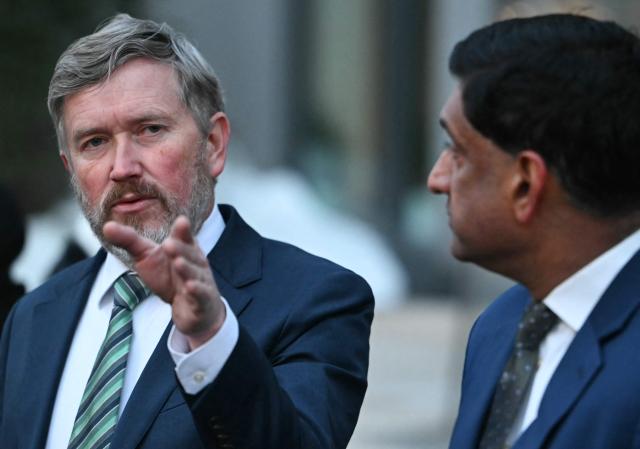 US Representatives Thomas Massie (L), Republican from Kentucky, and Ro Khanna, Democrat from California, speak to journalists outside the Department of Justice in Washington, DC, on February 9, 2026. Members of Congress will be allowed to review unredacted Jeffrey Epstein files on Department of Justice computers starting on February 9. (Photo by ANDREW CABALLERO-REYNOLDS / AFP)