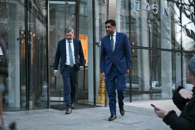 US Representatives Thomas Massie (L), Republican from Kentucky, and Ro Khanna, Democrat from California, exit the Department of Justice in Washington, DC, on February 9, 2026. Members of Congress will be allowed to review unredacted Jeffrey Epstein files on Department of Justice computers starting on February 9. (Photo by ANDREW CABALLERO-REYNOLDS / AFP)