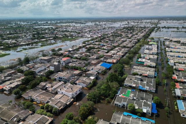 Aerial view of flooded streets in Monteria, Colombia taken on February 9, 2026. At least 13 deaths were reported this week in different parts of Colombia due to the intense rains battering the country, which are unusual for this time of year, according to a report on February 8, 2026, based on official information. (Photo by AFP)