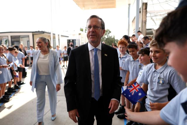 Israeli President Isaac Herzog meets students at Moriah War Memorial College during his state visit to Australia in Sydney on February 10, 2026. Herzog's tightly secured, four-day trip aims to console Australia's Jewish community after the December shooting at Sydney's Bondi Beach that killed 15 people at a Hanukkah festival. (Photo by Hollie Adams / POOL / AFP)
