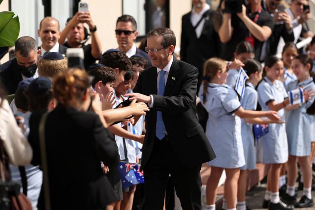 Israeli President Isaac Herzog meets students at Moriah War Memorial College during his state visit to Australia in Sydney on February 10, 2026. Herzog's tightly secured, four-day trip aims to console Australia's Jewish community after the December shooting at Sydney's Bondi Beach that killed 15 people at a Hanukkah festival. (Photo by Hollie Adams / POOL / AFP)
