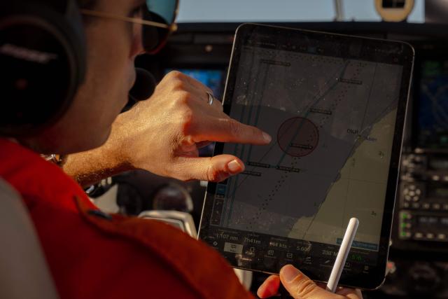 The pilot of the Humanitarian Pilot Initiative (HPI) checks the map before the takeoff for a monitoring mission between West Africa and the Canary Islands on January 22, 2026. The Swiss NGO, with 10 years of experience in central Mediterranean, is on its third mission on the Atlantic route, helping to spot distressed migrants boats and support rescues. Migrants leaving west Africa and traveling up the Atlantic are usually trying to reach Europe by first landing in the Canary Islands off northwestern Africa.
The Spanish archipelago is the jumping off point for their continued journey onward to the European continent.
More than 3,000 migrants died in 2025 while attempting to reach Spain clandestinely, according to the Spanish NGO Caminando Fronteras.
While HPI has operated for 10 years in the central Mediterranean, it is a relative newcomer to the Atlantic.
In the Mediterranean, it has already helped spot more than 1,000 boats, alerting international NGO rescue ships which can then go and help. (Photo by MICHELE CATTANI / AFP)
