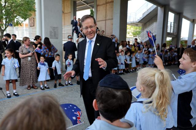 Israeli President Isaac Herzog meets students at Moriah War Memorial College during his state visit to Australia in Sydney on February 10, 2026. Herzog's tightly secured, four-day trip aims to console Australia's Jewish community after the December shooting at Sydney's Bondi Beach that killed 15 people at a Hanukkah festival. (Photo by Rohan Kelly / POOL / AFP)