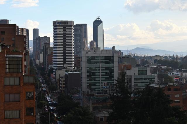 Vehicles drive along 13th Avenue during a traffic jam as they head toward downtown Bogota on February 9, 2026. (Photo by Diana SANCHEZ / AFP)