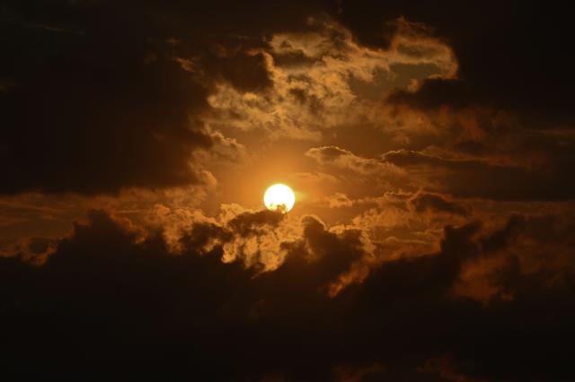 A sunset is seen in Bogota on February 9, 2026. (Photo by Diana SANCHEZ / AFP)