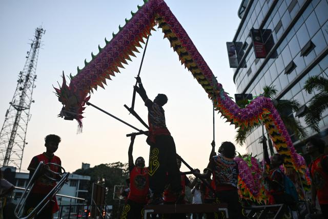 TOPSHOT - Lion dancers prepare to perform during celebrations marking the Chinese Lunar in Yangon on February 9, 2026, ahead of the upcoming Lunar New Year of the Horse. (Photo by Sai Aung MAIN / AFP)