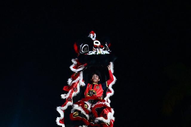 Lion dancers perform during celebrations marking the Chinese Lunar in Yangon on February 9, 2026, ahead of the upcoming Lunar New Year of the Horse. (Photo by Sai Aung MAIN / AFP)