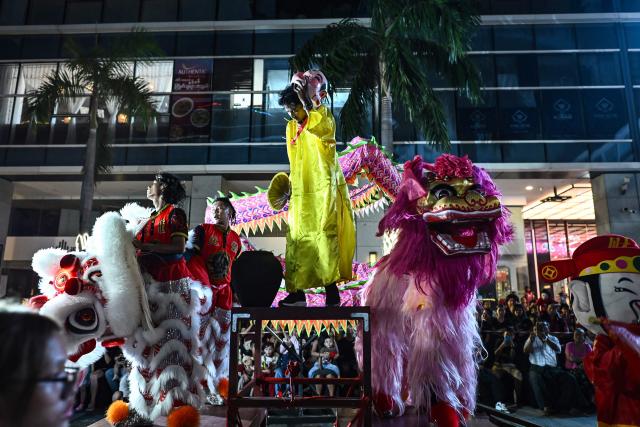 Dancers react at the end of their performance during celebrations marking the Chinese Lunar in Yangon on February 9, 2026, ahead of the upcoming Lunar New Year of the Horse. (Photo by Sai Aung MAIN / AFP)