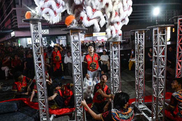 Lion dancers perform during celebrations marking the Chinese Lunar in Yangon on February 9, 2026, ahead of the upcoming Lunar New Year of the Horse. (Photo by Sai Aung MAIN / AFP)