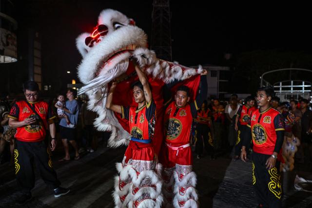Lion dancers prepare to perform during celebrations marking the Chinese Lunar in Yangon on February 9, 2026, ahead of the upcoming Lunar New Year of the Horse. (Photo by Sai Aung MAIN / AFP)
