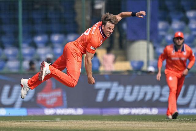 Netherlands' Logan van Beek delivers a ball during the 2026 ICC Men's T20 Cricket World Cup group stage match between Netherlands and Namibia at the Arun Jaitley Stadium in New Delhi on February 10, 2026. (Photo by Arun SANKAR / AFP)