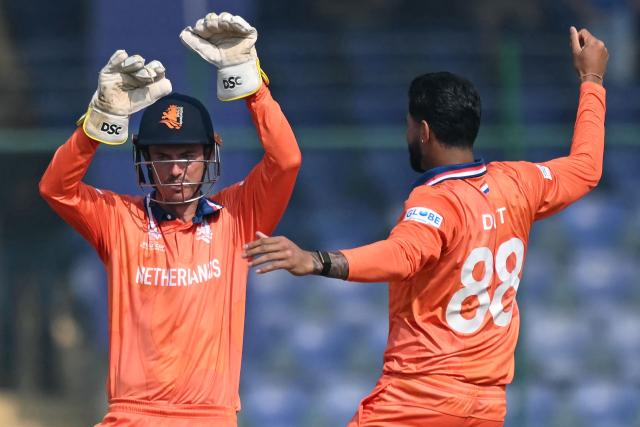 Netherlands' wicketkeeper and captain Scott Edwards (L) celebrates with Aryan Dutt after the dismissal of Namibia's Louren Steenkamp during the 2026 ICC Men's T20 Cricket World Cup group stage match between Netherlands and Namibia at the Arun Jaitley Stadium in New Delhi on February 10, 2026. (Photo by Arun SANKAR / AFP)