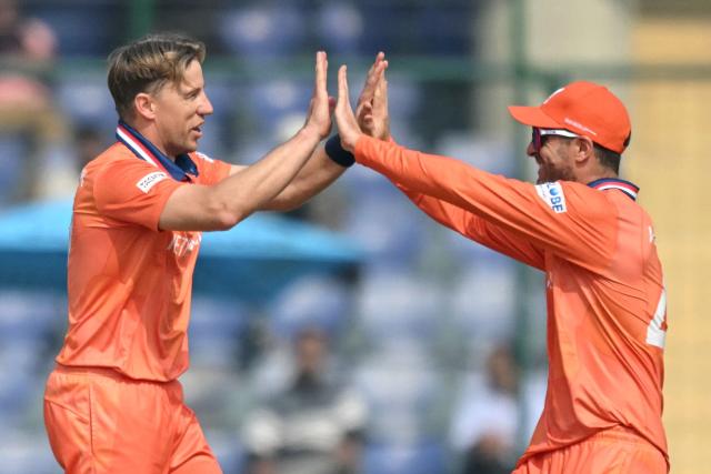 Netherlands' Logan van Beek (L) celebrates with teammate after taking the wicket of Namibia's Jan Frylinck during the 2026 ICC Men's T20 Cricket World Cup group stage match between Netherlands and Namibia at the Arun Jaitley Stadium in New Delhi on February 10, 2026. (Photo by Arun SANKAR / AFP)