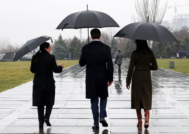 US Vice President JD Vance and second lady, Usha Vance, leave with Edita G. Gzoyan, director of the Armenian Genocide Museum-Institute, following a visit to the Tsitsernakaberd Armenian Genocide Memorial, in Yerevan, Armenia, on February 10, 2026. (Photo by Kevin Lamarque / POOL / AFP)