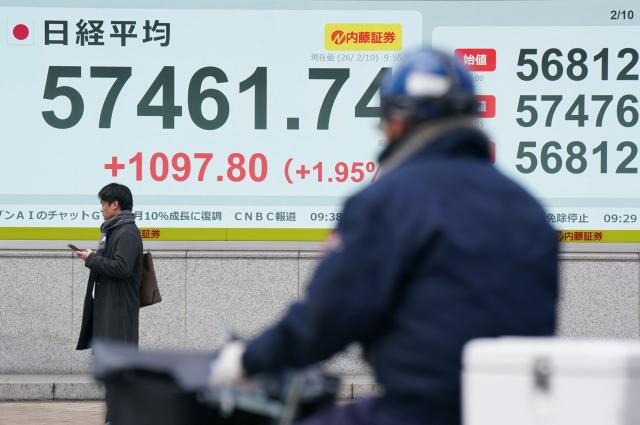 An electronic quotation board displays numbers of the Nikkei Stock Average on the Tokyo Stock Exchange along a street in Tokyo on February 10, 2026. (Photo by Kazuhiro NOGI / AFP)
