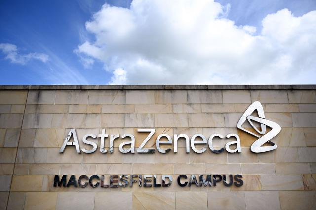 (FILES) A logo adorns an exterior wall of  the offices of pharmaceutical company AstraZeneca in Macclesfield, central England on May 11, 2021. British pharmaceutical giant AstraZeneca on February 10, 2026, said its net profit jumped 45 percent last year on strong sales of cancer drugs, as it zoned in on the United States. Profit after tax rose to USD10.2 billion in 2025 from USD7 billion one year earlier, AstraZeneca said in a statement. (Photo by Paul ELLIS / AFP)