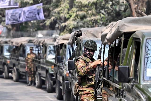 Bangladesh Army personnel patrol in Dhaka on February 10, 2025 ahead of the country's general election on February 12. (Photo by MUNIR UZ ZAMAN / AFP)