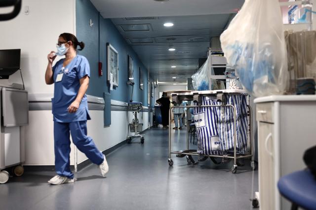 A nurse walks through the corridors of the sterile ward at the Timone pediatric hospital in Marseille on January 23, 2026. The “Sourire а la vie” association, which operates within the hospital, offers children with cancer to engage in physical activity during their often lengthy hospital stays. (Photo by Thibaud MORITZ / AFP)