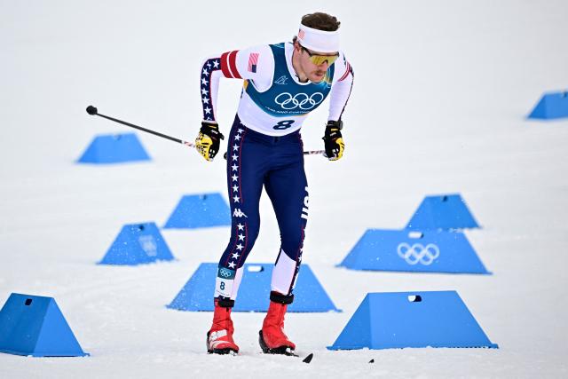 USA's Ben Ogden competes during the men's cross country sprint classic qualification event of the Milano Cortina 2026 Winter Olympic Games at Tesero Cross-Country Skiing Stadium in Lago di Tesero (Val di Fiemme), on February 10, 2026. (Photo by Tobias SCHWARZ / AFP)