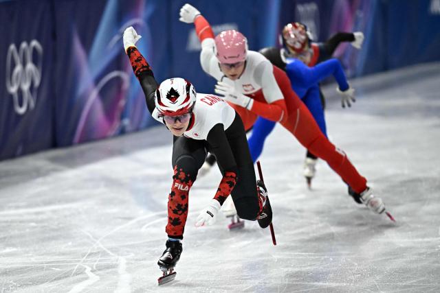 Canada's Kim Boutin, Poland's Natalia Maliszewska, Individual Neutral Athlete Alena Krylova and South Korea's Lee So-yeon compete in the short track speed skating women's 500m heats during the Milano Cortina 2026 Winter Olympic Games at Milano Ice Skating Arena in Milan on February 10, 2026. (Photo by Gabriel BOUYS / AFP)