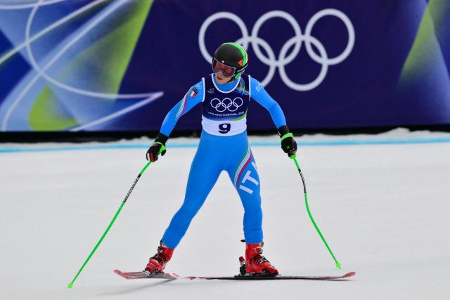 Italy's Sofia Goggia reacts in the finish area after crashing in the  downhill run of the women's team combined event during the Milano Cortina 2026 Winter Olympic Games at the Tofane Alpine Skiing Centre in Cortina d’Ampezzo on February 10, 2026. (Photo by Stefano RELLANDINI / AFP)