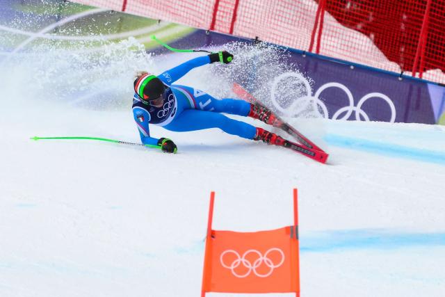 Italy's Sofia Goggia crashes as she competes in the downhill run of the women's team combined event during the Milano Cortina 2026 Winter Olympic Games at the Tofane Alpine Skiing Centre in Cortina d’Ampezzo on February 10, 2026. (Photo by Marco BERTORELLO / AFP)