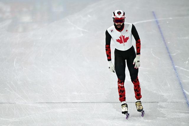 Canada's Steven Dubois reacts after competing in the short track speed skating men's 1000m heats during the Milano Cortina 2026 Winter Olympic Games at Milano Ice Skating Arena in Milan on February 10, 2026. (Photo by JULIEN DE ROSA / AFP)